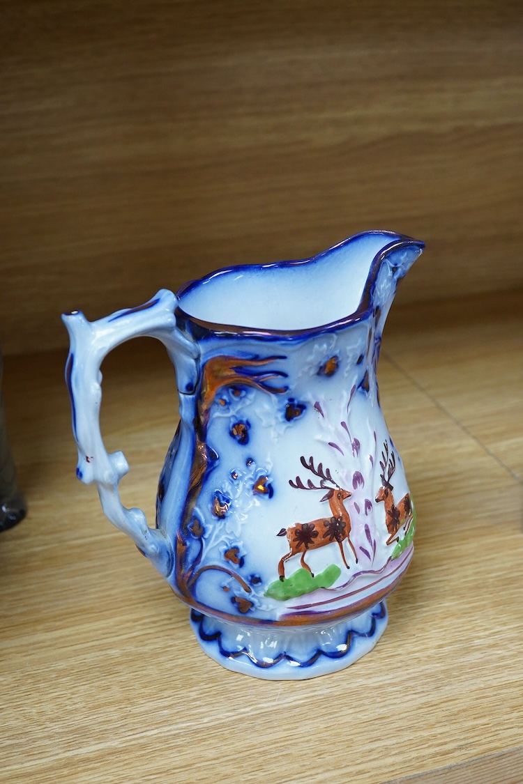 A Beswick model of an elephant and a Staffordshire jug, c.1840, largest 34cm wide